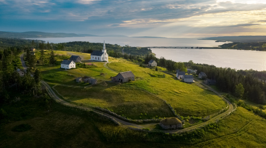 Areal view of a church on a green field